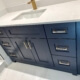 Bathroom renovation with blue custom vanity